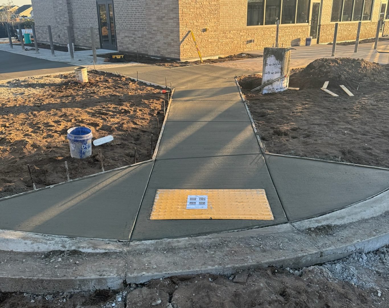 Freshly poured concrete driveway installation by DiMaio Concrete & Construction in Wilmington, NC