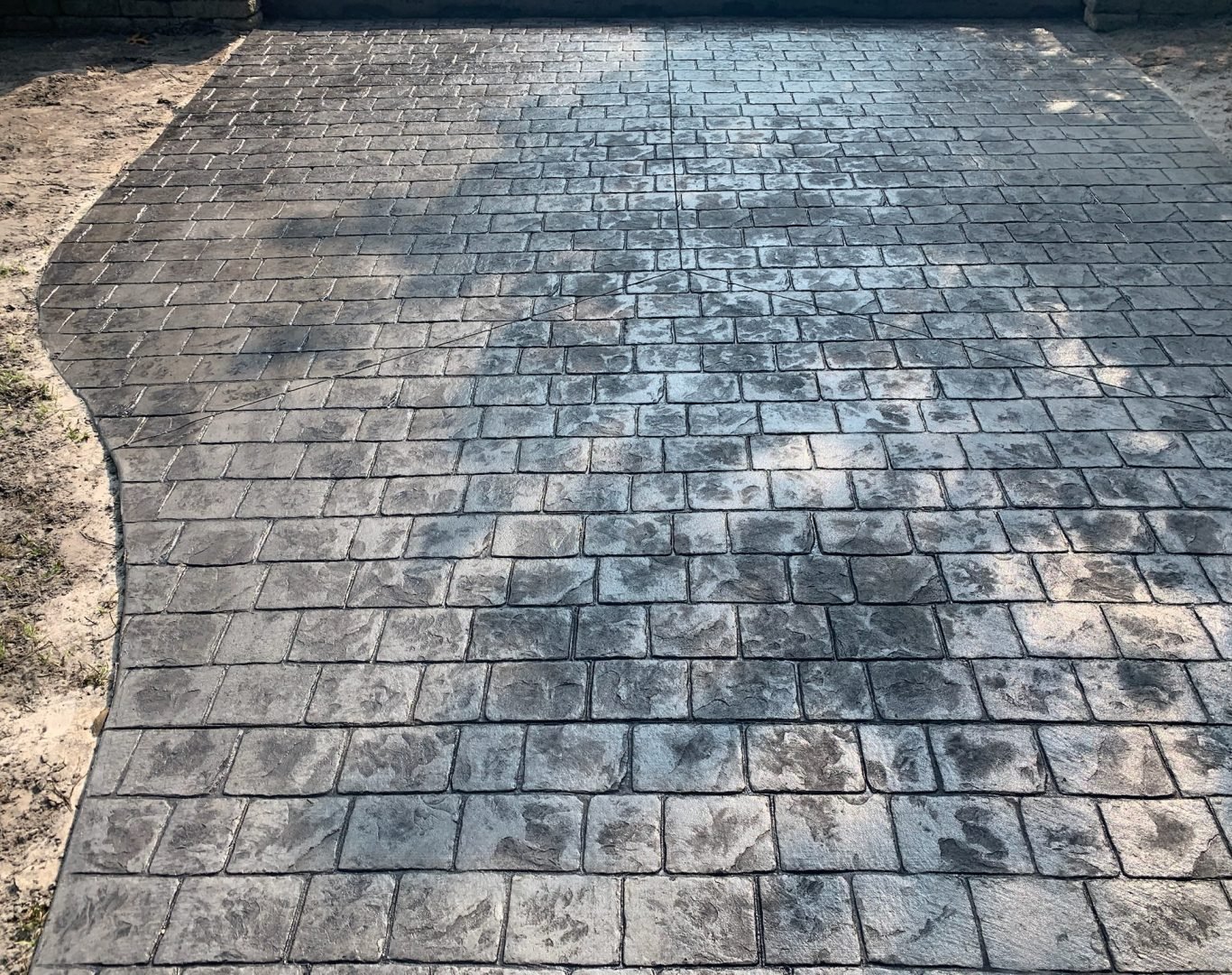 Freshly poured concrete driveway installation by DiMaio Concrete & Construction in Wilmington, NC